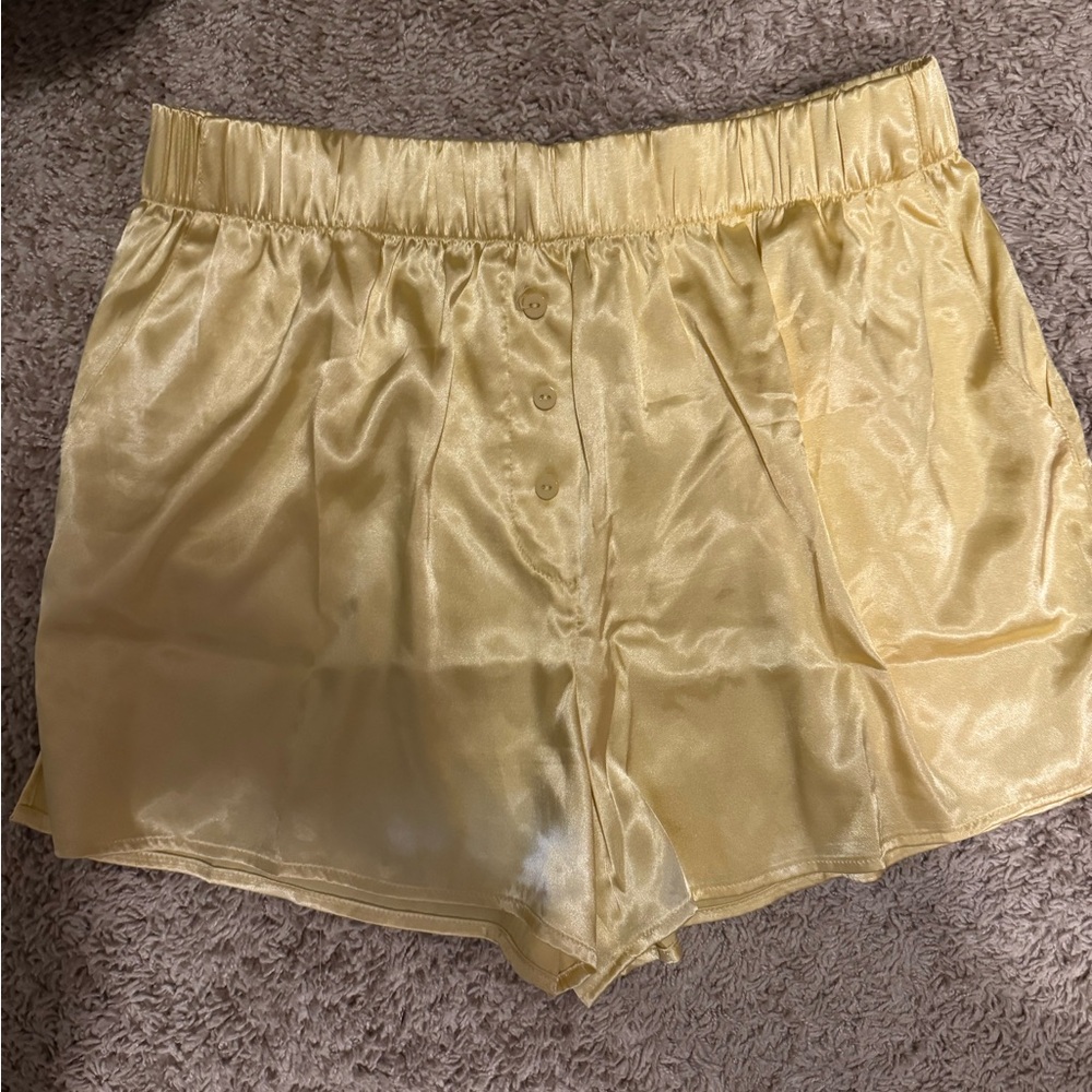 Great condition Daily Drills yellow silk shorts. M/L.